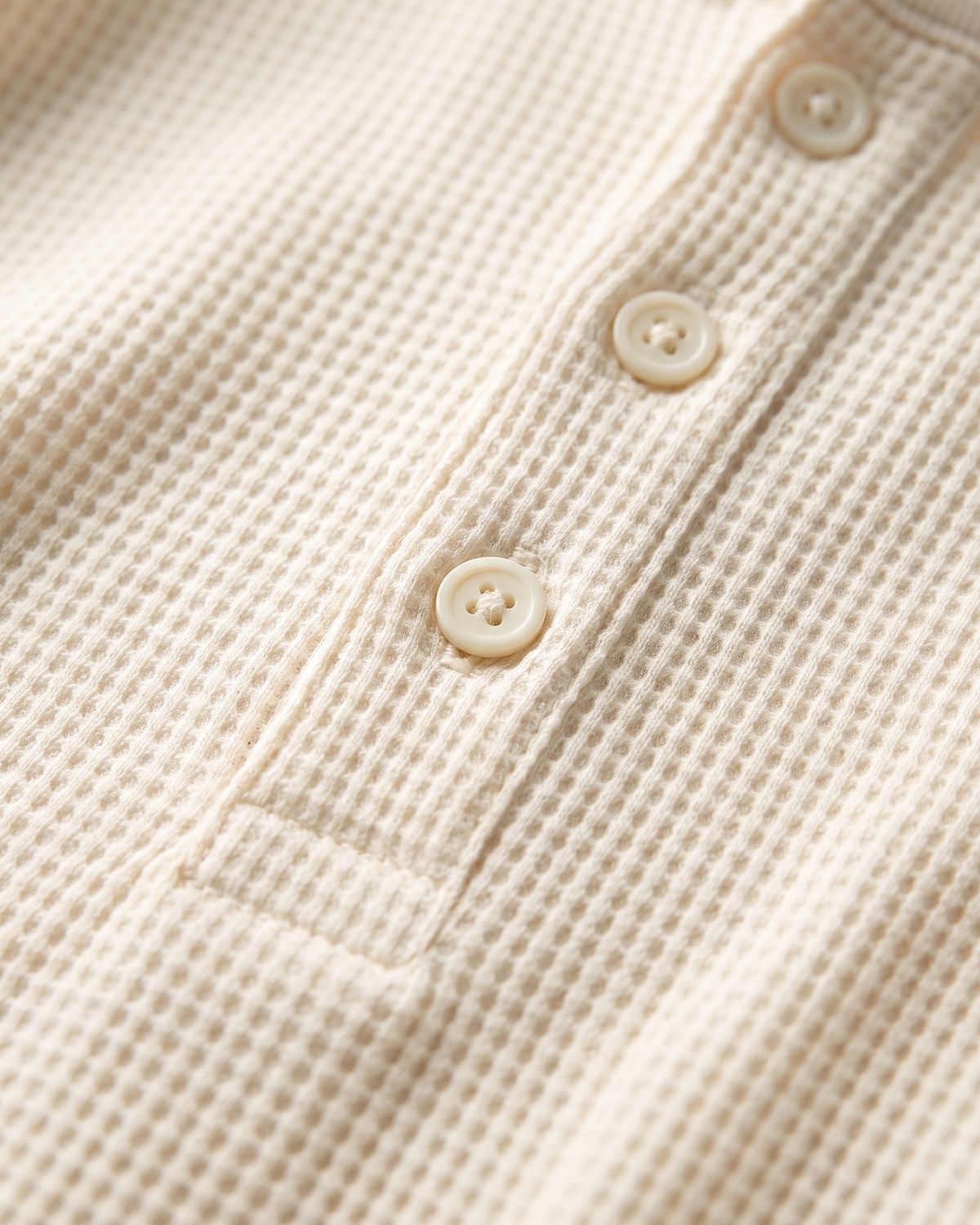 Close-up macro of the Atlas Waffle Henley waffle-knit texture