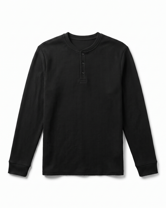 Atlas Waffle Henley in black, flat lay showing three-button placket and ribbed cuffs